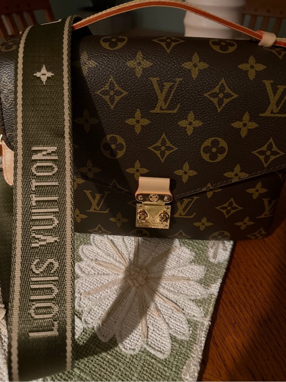 Leather Monogram crossbody in Brown. Suede inside lining.